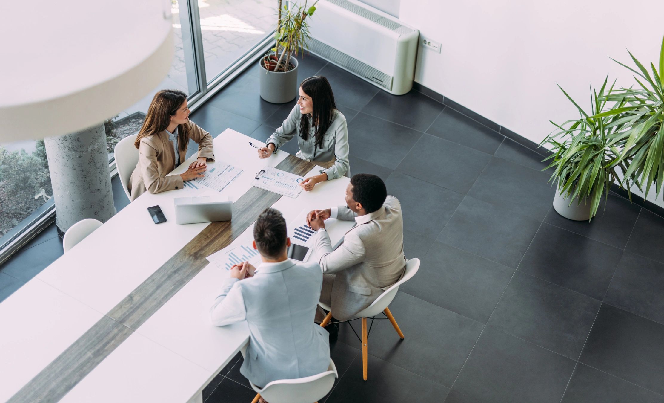 Business consultants collaborating around a boardroom table