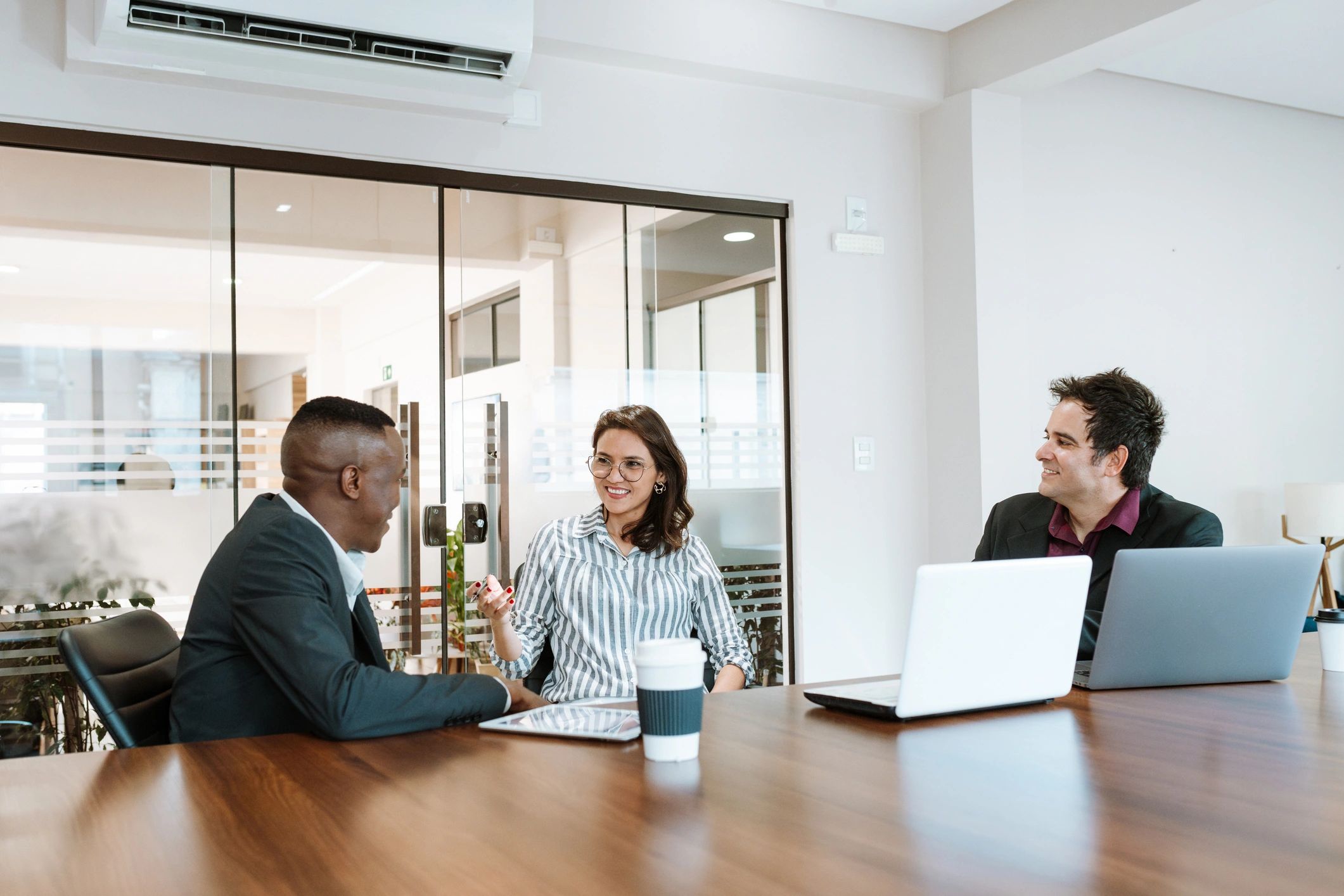 Consulting team in a meeting room discussing strategy