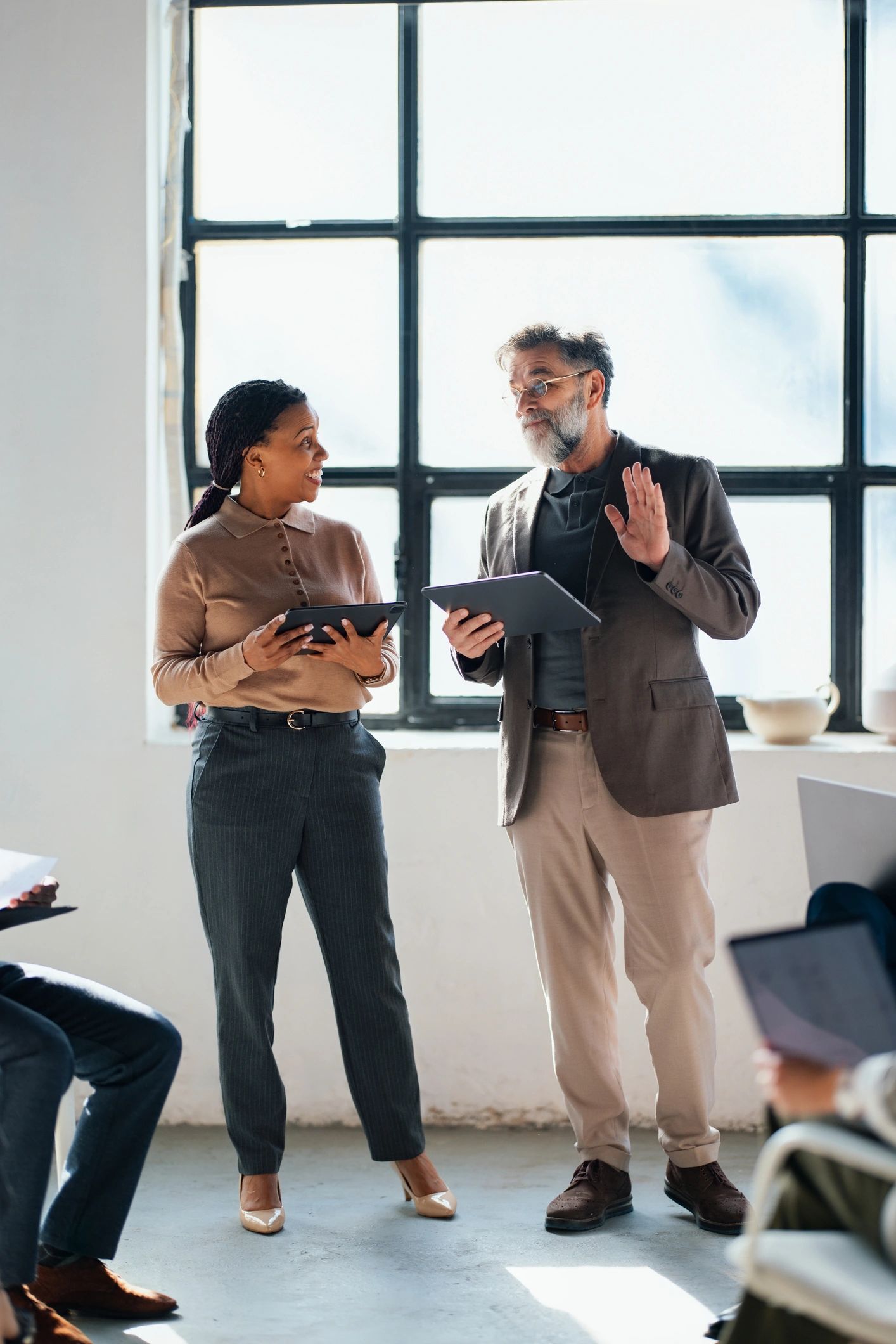 Business professionals discussing strategy in a modern office